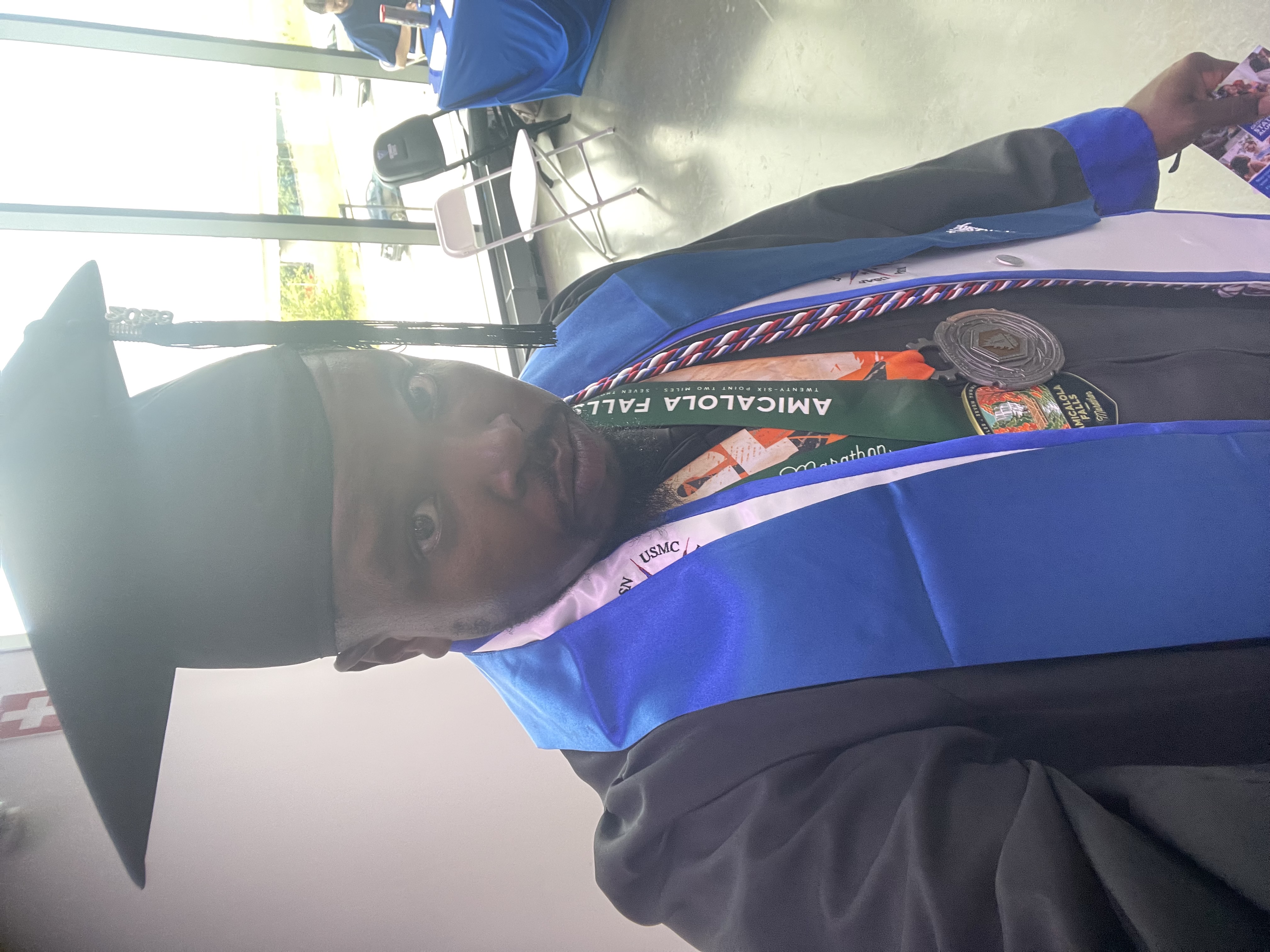 Darin Ward wearing graduation cap and gown